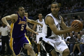 SAN ANTONIO - MAY 25:  Tony Parker #9 of the San Antonio Spurs drives past Jordan Farmar #5 of the Los Angeles Lakers in Game Three of the Western Conference Finals during the 2008 NBA Playoffs on May 25, 2008 at the AT&T Center in San Antonio, Texas. NOT
