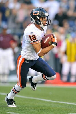 SEATTLE - SEPTEMBER 27: Johnny Knox #13 of the Chicago Bears carries the ball during the game against the Seattle Seahawks on September 27, 2009 at Qwest Field in Seattle, Washington. The Bears defeated the Seahawks 25-19.  (Photo by Otto Greule Jr/Getty 