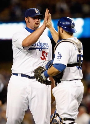 LOS ANGELES, CA - SEPTEMBER 14:  Jonathan Broxton (L) #51 of the Los Angeles Dodgers is congratulated by Russell Martin #55  after Boxton saved the game against the Pittsburgh Pirates at Dodger Stadium on September 14, 2009 in Los Angeles, California. The