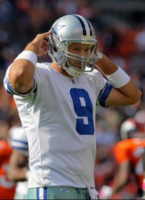 DENVER - OCTOBER 04:  Quarterback Tony Romo #9 of the Dallas Cowboys walks to the bench after failing to convert a third down against the Denver Broncos during NFL action at Invesco Field at Mile High on October 4, 2009 in Denver, Colorado. The Broncos de