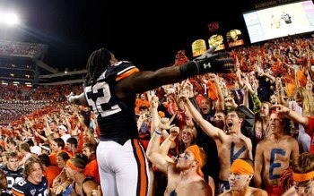 AUBURN, AL - SEPTEMBER 19:  Antonio Coleman #52 of the Auburn Tigers cheers with the fans against the West Virginia Mountaineers at Jordan-Hare Stadium on September 19, 2009 in Auburn, Alabama.  (Photo by Kevin C. Cox/Getty Images)