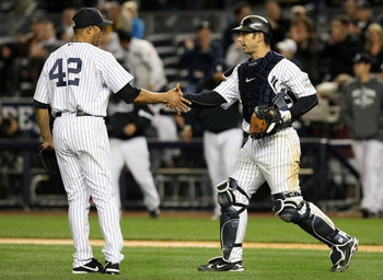NEW YORK - OCTOBER 07: Mariano Rivera #42 and Jorge Posada #20 of the New York Yankees celebrate after defeating the Minnesota Twins to win Game One of the ALDS during the 2009 MLB Playoffs at Yankee Stadium on October 7, 2009 in the Bronx borough of New