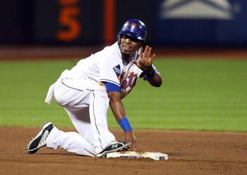 NEW YORK - MAY 12:  Jose Reyes #7 of the New York Mets is safe at second base against the Atlanta Braves on May 12, 2009 at Citi Field in the Flushing neighborhood of the Queens borough of New York City. The Mets defeated the Braves 4-3 in ten innings.  (