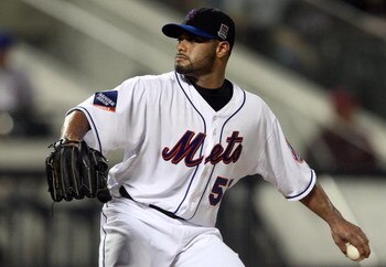 NEW YORK - AUGUST 20:  Johan Santana #57 of the New York Mets delivers a pitch against the Atlanta Braves on August 20, 2009 at Citi Field in the Flushing neighborhood of the Queens borough of New York City.  (Photo by Jim McIsaac/Getty Images)