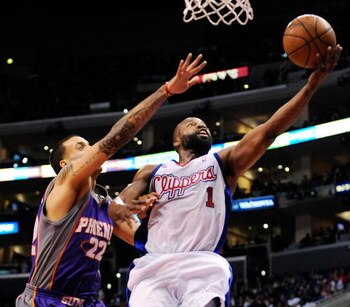 LOS ANGELES, CA - FEBRUARY 18:  Baron Davis #1 of the Los Angeles Clippers scores on a layup against Matt Barnes #22 of the Phoenix Suns at the Staples Center February 18, 2009, in Los Angeles, California. NOTE TO USER: User expressly acknowledges and agr