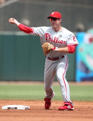 SAN FRANCISCO - AUGUST 02:  Chase Utley #26 of the Philadelphia Phillies throw to first against the San Francisco Giants  during a Major League Baseball game at AT&T Park on August 2, 2009 in San Francisco, California.  (Photo by Jed Jacobsohn/Getty Image