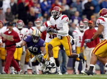 SEATTLE - SEPTEMBER 19:  Joe McKnight #4 of the USC Trojans carries the ball during the game against the Washington Huskies on September 19, 2009 at Husky Stadium in Seattle, Washington. The Huskies defeated the Trojans 16-13. (Photo by Otto Greule Jr/Get