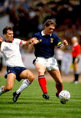 27 May 1989:  Scotland Captain Roy Aitken takes on England Captain Bryan Robson during the Rous Cup match at Hampden Park in Glasgow, Scotland. England won the match 2-0. \ Mandatory Credit: Dave  Cannon/Allsport