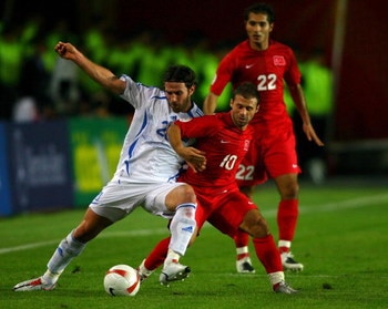 ISTANBUL, TURKEY - OCTOBER 17: Ioannis Amanatidis of Greece (l) battles with Turkey forward Gokdeniz Karadeniz during the Euro 2008 Qualifying match between Turkey and Greece at Ali Sami Yen Stadium on October 17, 2007 in Istanbul,Turkey.  (Photo by Stu F