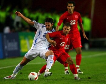 ISTANBUL, TURKEY - OCTOBER 17: Ioannis Amanatidis of Greece (l) battles with Turkey forward Gokdeniz Karadeniz during the Euro 2008 Qualifying match between Turkey and Greece at Ali Sami Yen Stadium on October 17, 2007 in Istanbul,Turkey.  (Photo by Stu F