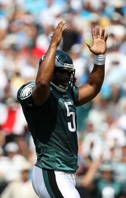 CHARLOTTE, NC - SEPTEMBER 13:  Quarterback Donovan McNabb #5 of the Philadelphia Eagles signals celebrates after a touchdown in the first half of their NFL season opener against the Carolina Panthers at Bank of America Stadium on September 13, 2009 in Cha