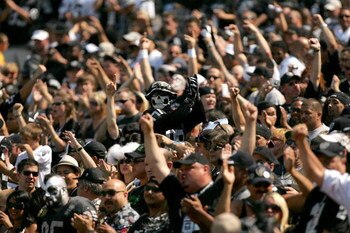 OAKLAND, CA - SEPTEMBER 27:  Oakland Raiders fans cheer for their team before their game against the Denver Broncos at the Oakland-Alameda County Coliseum on September 27, 2009 in Oakland, California.  (Photo by Ezra Shaw/Getty Images)