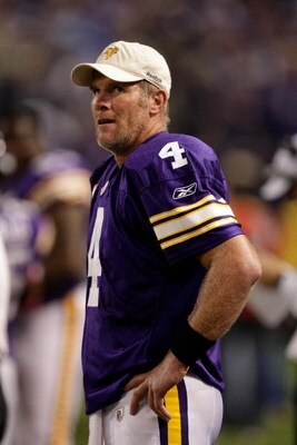 MINNEAPOLIS - OCTOBER 05:  Quarterback Brett Favre #4 of the Minnesota Vikings watches the reply from the sidelines after a touchdown during the game against the Green Bay Packers on October 5, 2009 at Hubert H. Humphrey Metrodome in Minneapolis, Minnesot