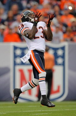 DENVER - AUGUST 30:  Kick returner Devin Hester #23 of the Chicago Bears recieves a kick off against the Denver Broncos during preseason NFL action at INVESCO Field at Mile High on August 30, 2009 in Denver, Colorado. The Bears defeated the Broncos 27-17.