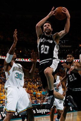 NEW ORLEANS - MAY 13:  Manu Ginobili #20 of the San Antonio Spurs shoots over David West #30 of the New Orleans Hornets in Game Five of the Western Conference Semifinals during the 2008 NBA Playoffs at The New Orleans Arena on May 13, 2008 in New Orleans,