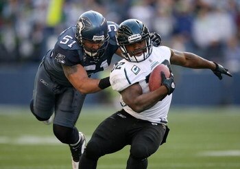 SEATTLE - OCTOBER 11:  Running back Maurice Jones-Drew #32 of the Jacksonville Jaguars is tackled by Lofa Tatupu #51 of the Seattle Seahawks on October 11, 2009 at Qwest Field in Seattle, Washington. The Seahawks defeated the Jaguars 41-0. (Photo by Otto 