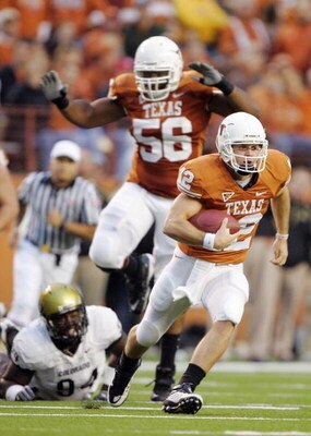 AUSTIN, TX - OCTOBER 10: Quarterback Colt McCoy #12 of the Texas Longhorns takes off running for a first down against the Colorado Buffaloes in the first quarter on October 10, 2009 at Darrell K Royal-Texas Memorial Stadium in Austin, Texas. (Photo by Bri