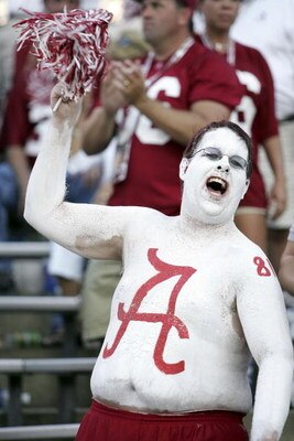 GAINESVILLE, FL - SEPTEMBER 30:  An Alabama Crimson Tida fan cheers his team as they play the Florida Gators at Ben Hill Griffin Stadium at Florida Field September 30, 2006 in Gainsville, Florida.  (Photo by Marc Serota/Getty Images)