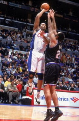 27 Jan 2001:  Michael Olowokandi #31 of the Los Angeles Clippers shoots the ball over Vlade Divac #21 of the Sacramento Kings during the game at the STAPLES Center in Los Angeles, California.  The Kings defeated the Clippers 101-89.  NOTE TO USER: It is e