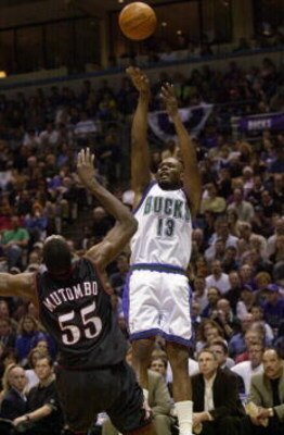 26 May 2001:  Glenn Robinson #13 of the Milwaukee Bucks puts a shot up over Dikembe Mutombo #55 of the Philadelphia 76ers in game three of the eastern conference finals at the Bradley Center in Milwaukee, Wisconsin.  The Bucks won 80-74.  DIGITAL IMAGE.  