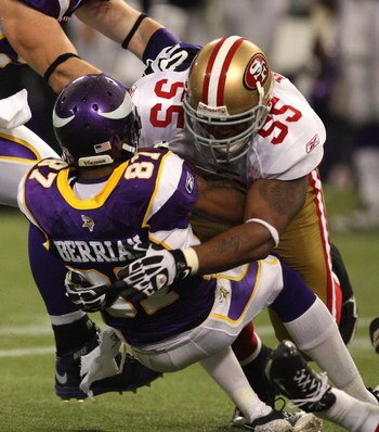MINNEAPOLIS - SEPTEMBER 27: Ahmad Brooks #55 of the San Francisco 49ers tackles Bernard Berrian #87 of the Minnesota Vikings at the Hubert H. Humphrey Metrodome on September 27, 2009 in Minneapolis, Minnesota. The Vikings defeated the 49ers 27-24. (Photo 
