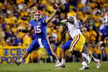 BATON ROUGE, LA - OCTOBER 10:  Quarterback Tim Tebow #15 of the Florida Gators scrambles as he throws a pass against the Louisiana State University Tigers at Tiger Stadium on October 10, 2009 in Baton Rouge, Louisiana.  (Photo by Kevin C. Cox/Getty Images