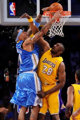 LOS ANGELES, CA - MAY 19:  Kenyon Martin #4 of the Denver Nuggets goes up for a dunk over DJ Mbenga #28 of the Los Angeles Lakers in the second quarter of Game One of the Western Conference Finals during the 2009 NBA Playoffs at Staples Center on May 19, 