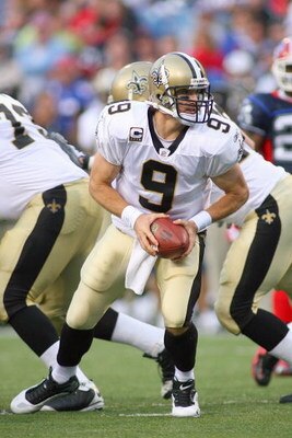 ORCHARD PARK, NY - SEPTEMBER 27:  Quarterback Drew Brees #9 of the New Orleans Saints looks to hand off the ball during the game against the Buffalo Bills at Ralph Wilson Stadium on September 27, 2009 in Orchard Park, New York. The Saints won 27-7. (Photo