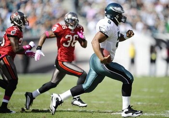 PHILADELPHIA - OCTOBER 11:  Donovan McNabb #5 of the Philadelphia Eagles runs the ball away from Tanard Jackson #36 and Aqib Talib #25 of the Tampa Bay Buccaneers at Lincoln Financial Field on October 11, 2009 in Philadelphia, Pennsylvania.  (Photo by Jef