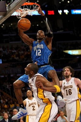 LOS ANGELES, CA - JUNE 07:  Dwight Howard #12 of the Orlando Magic slam dunks over Kobe Bryant #24 of the Los Angeles Lakers in Game Two of the 2009 NBA Finals at Staples Center on June 7, 2009 in Los Angeles, California. NOTE TO USER: User expressly ackn