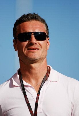 BUDAPEST, HUNGARY - JULY 24:  Former F1 driver David Coulthard of Great Britain walks down the paddock following practice for the Hungarian Formula One Grand Prix at the Hungaroring on July 24, 2009 in Budapest, Hungary.  (Photo by Paul Gilham/Getty Image