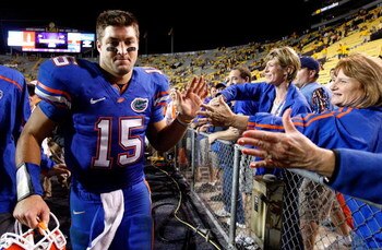 BATON ROUGE, LA - OCTOBER 10:  Quarterback Tim Tebow #15 of the Florida Gators celebrates their 13-3 win over the Louisiana State University Tigers with fans at Tiger Stadium on October 10, 2009 in Baton Rouge, Louisiana.  (Photo by Kevin C. Cox/Getty Ima