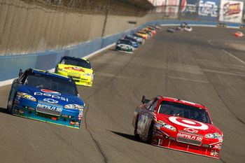 FONTANA, CA - OCTOBER 11: Juan Pablo Montoya, driver of the #42 Target Chevrolet, races Jeff Gordon, driver of the #24 Pepsi Chevrolet, during the NASCAR Sprint Cup Series Pepsi 500 at Auto Club Speedway on October 11, 2009 in Fontana, California. (Phot