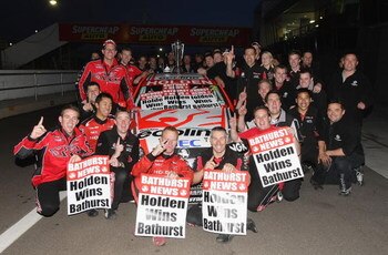 BATHURST, AUSTRALIA - OCTOBER 11:  The Holden Racing Team pose for a team photo after drivers Will Davison and Garth Tander drivers of the #2 Holden Racing Team Holden won the Bathurst 1000, which is round 10 of the V8 Supercars Championship Series  at Mo