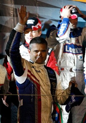MONTEREY, CA - OCTOBER 10:  Gil de Ferran, driver of the #66 de Ferran Motorsports XM Radio Acura ARX-02a celebrates on the podium after winning the ALMS Monterey Sports Car Championships at Mazda Laguna Seca Raceway on October 10, 2009 in Monterey, Calif