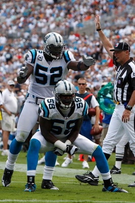 CHARLOTTE, NC - SEPTEMBER 14:  Thomas Davis #58 and teammate Jon Beason #52 of the Carolina Panthers celebrate after a defensive stop against the Chicago Bears during their game at Bank of America Stadium on September 14, 2008 in Charlotte, North Carolina
