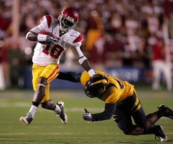 BERKELEY, CA - OCTOBER 03:  Damian Willliams #18 of the USC Trojans tries to avoid Marcus Ezeff #29 of the California Golden Bears at California Memorial Stadium on October 3, 2009 in Berkeley, California.  (Photo by Ezra Shaw/Getty Images)