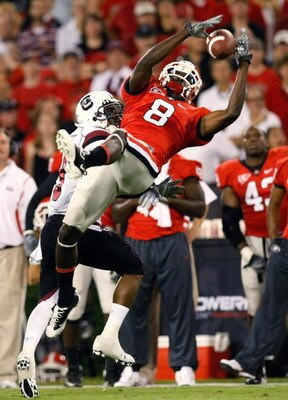 ATHENS, GA - SEPTEMBER 12:  A.J. Green #8 of the Georgia Bulldogs pulls in this reception against Akeem Auguste #3 of the South Carolina Gamecocks at Sanford Stadium on September 12, 2009 in Athens, Georgia.  (Photo by Kevin C. Cox/Getty Images)