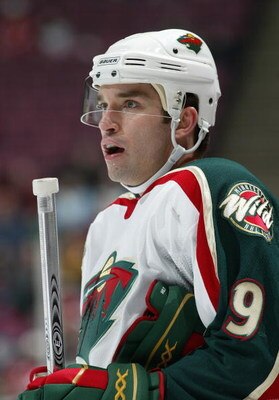 EAST RUTHERFORD, NJ - DECEMBER 3:  Alexandre Daigle #9 of the Minnesota Wild looks on during a break in NHL game action against the New Jersey Devils at Continental Airlines Arena on December 3, 2005 in East Rutherford, New Jersey.  The Devils defeated th