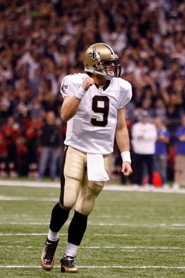 NEW ORLEANS - OCTOBER 18:  Drew Brees #9 of the New Orleans Saints celebrates after watching Mike Bell #21 score a touchdown against the New York Giants at the Louisiana Superdome on October 18, 2009 in New Orleans, Louisiana.  (Photo by Chris Graythen/Ge