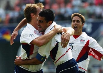 JEONJU - JUNE 17:  Brian McBride of the USA celebrates his goal with team mate Claudio Reyna during the Mexico v USA, World Cup Second Round match played at the Jeonju World Cup Stadium, Jeonju, South Korea on June 17, 2002. The USA won 2-0. (Photo by Chu