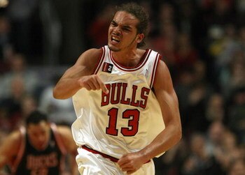 CHICAGO - MARCH 06:  Joakim Noah #13 of the Chicago Bulls reacts after dunked the ball in the second quarter against the Milwaukee Bucks at the United Center on March 6, 2009 in Chicago, Illinois.  NOTE TO USER: User expressly acknowledges and agreees tha
