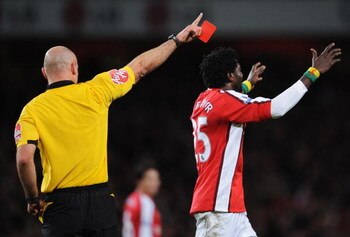 LONDON - DECEMBER 21:  Emmanuel Adebayor of Arsenal reacts as he is sent off by referee Howard Webb during the Barclays Premier League match between Arsenal and Liverpool at the Emirates Stadium on December 21, 2008 in London, England.  (Photo by Clive Ma