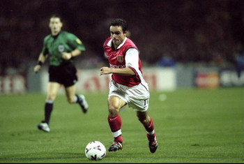 27 Oct 1999: Marc Overmars of Arsenal in action during the UEFA European Champions League Group B match against Fiorentina played at Wembley Stadium, London. The game finished in a 1-0 away win for Fiorentina and saw the elimination of Arsenal from these
