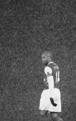 BLACKBURN, UNITED KINGDOM - JANUARY 13: Thierry Henry of Arsenal looks on  in the rain during the Barclays Premiership match between Blackburn Rovers and Arsenal at Ewood Park on January 13, 2007 in Blackburn, England. (Photo by Laurence Griffiths/Getty I