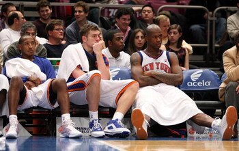 NEW YORK - DECEMBER 19: (L-R) Chris Duhon #1, David Lee #42 and Al Harrington #7 of the New York Knicks watch on from the bench against the Milwaukee Bucks on December 19, 2008 at Madison Square Garden in New York City, New York. NOTE TO USER: User expres