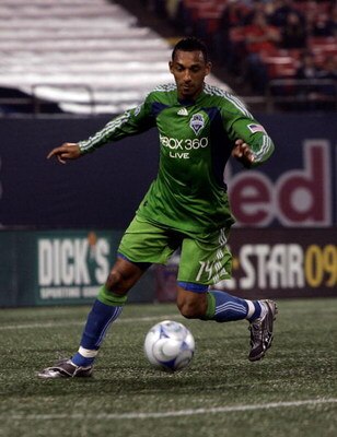 EAST RUTHERFORD, NJ - JUNE 20:  Tyrone Marshall #14 of the Seattle Sounders FC plays the ball against the New York Red Bulls at Giants Stadium in the Meadowlands on June 20, 2009 in East Rutherford, New Jersey.  (Photo by Mike Stobe/Getty Images for New Y