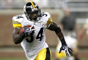 DETROIT , MI - OCTOBER 11:  Rashard Mendenhall #34 of the Pittsburgh Steelers runs for a first quarter touchdown while playing the Detroit Lions on October 11, 2009 at Ford Field in Detroit, Michigan. Pittsburgh won the game 28-20. (Photo by Gregory Shamu