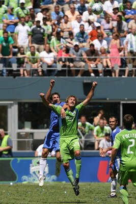 SEATTLE - JULY 18:  Roger Levesque of Seattle Sounders FC goes up for the header against Juliano Belletti #35 of Chelsea FC during the game on July 18, 2009 at Qwest Field in Seattle, Washington. (Photo by Otto Greule Jr/Getty Images) 