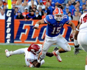 GAINESVILLE, FL - OCTOBER 17: Quarterback Tim Tebow #15 of the Florida Gators rushes upfield against the University of Arkansas Razorbacks October 17, 2009 at Ben Hill Griffin Stadium in Gainesville, Florida.  (Photo by Al Messerschmidt/Getty Images)